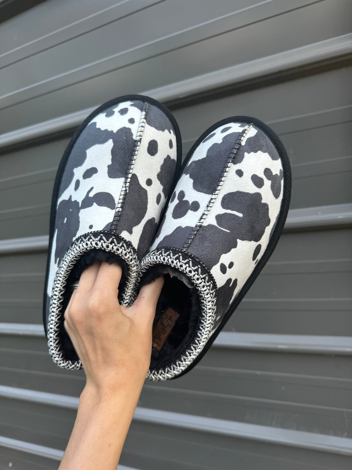 Cow print bruin slippers